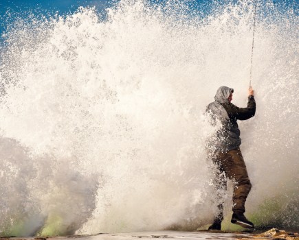 A crashing wave fills the frame of the photo