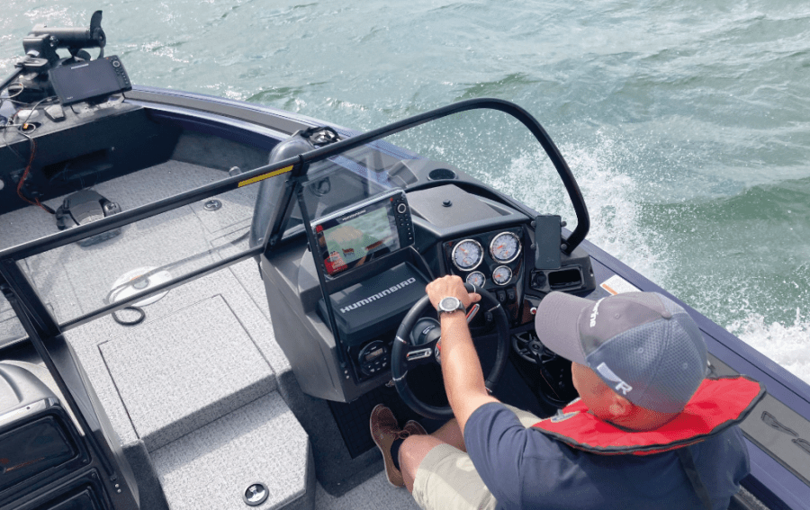 Ben at helm of boat