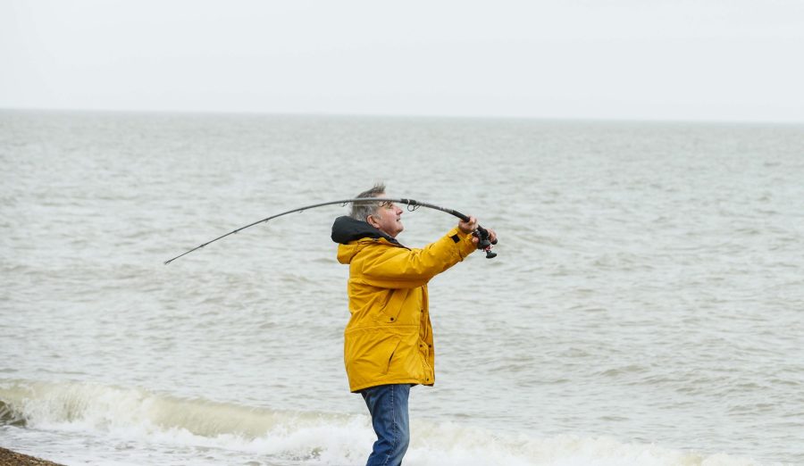 Man casting Fireblade on beach