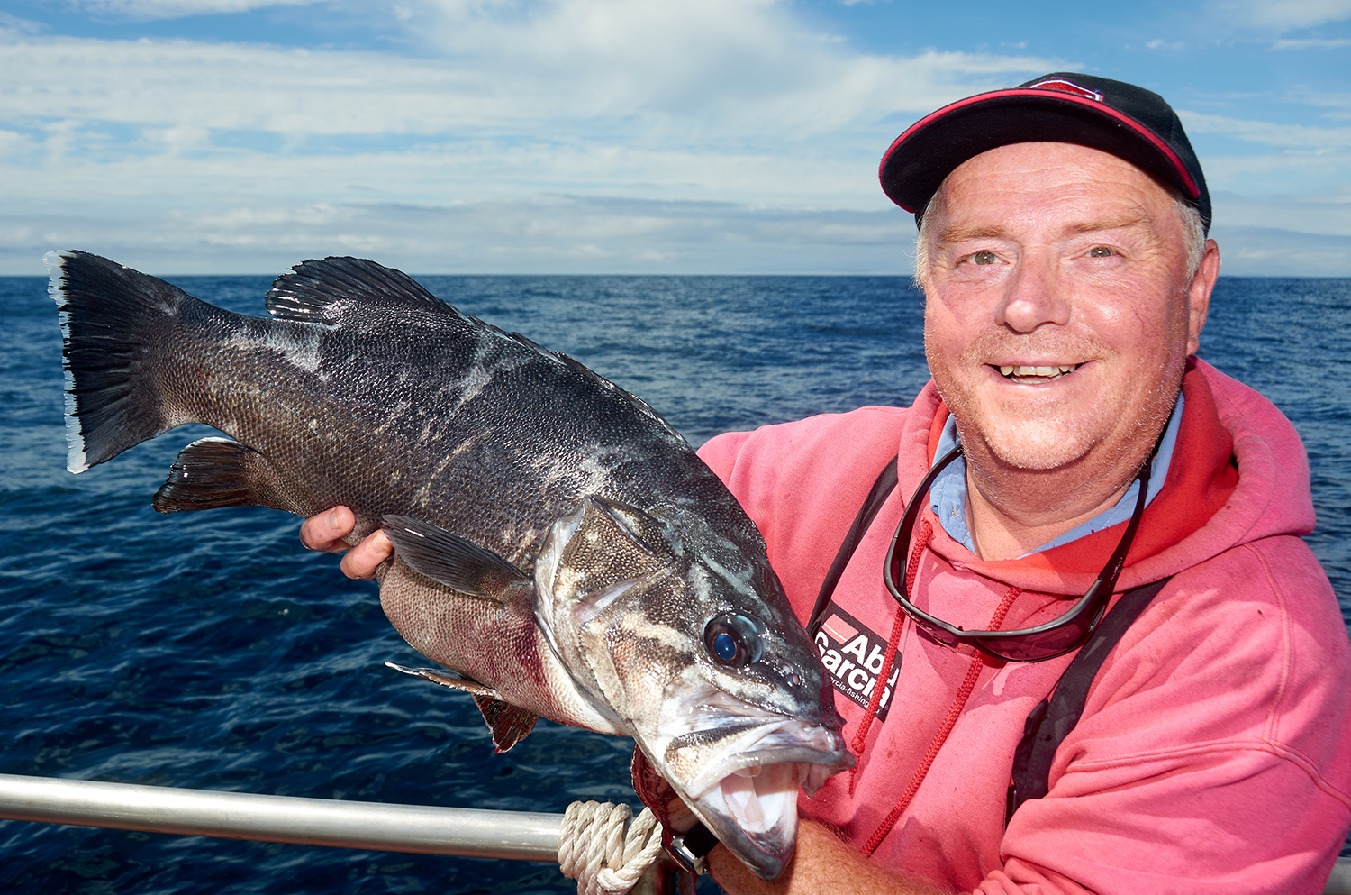 Mike with stone basse fish