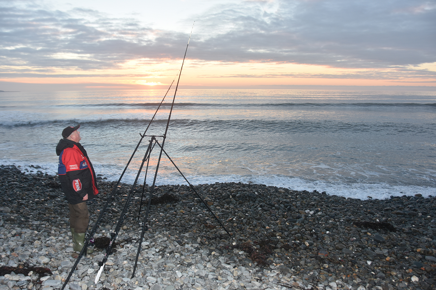 Man fishing for whiting on a beach