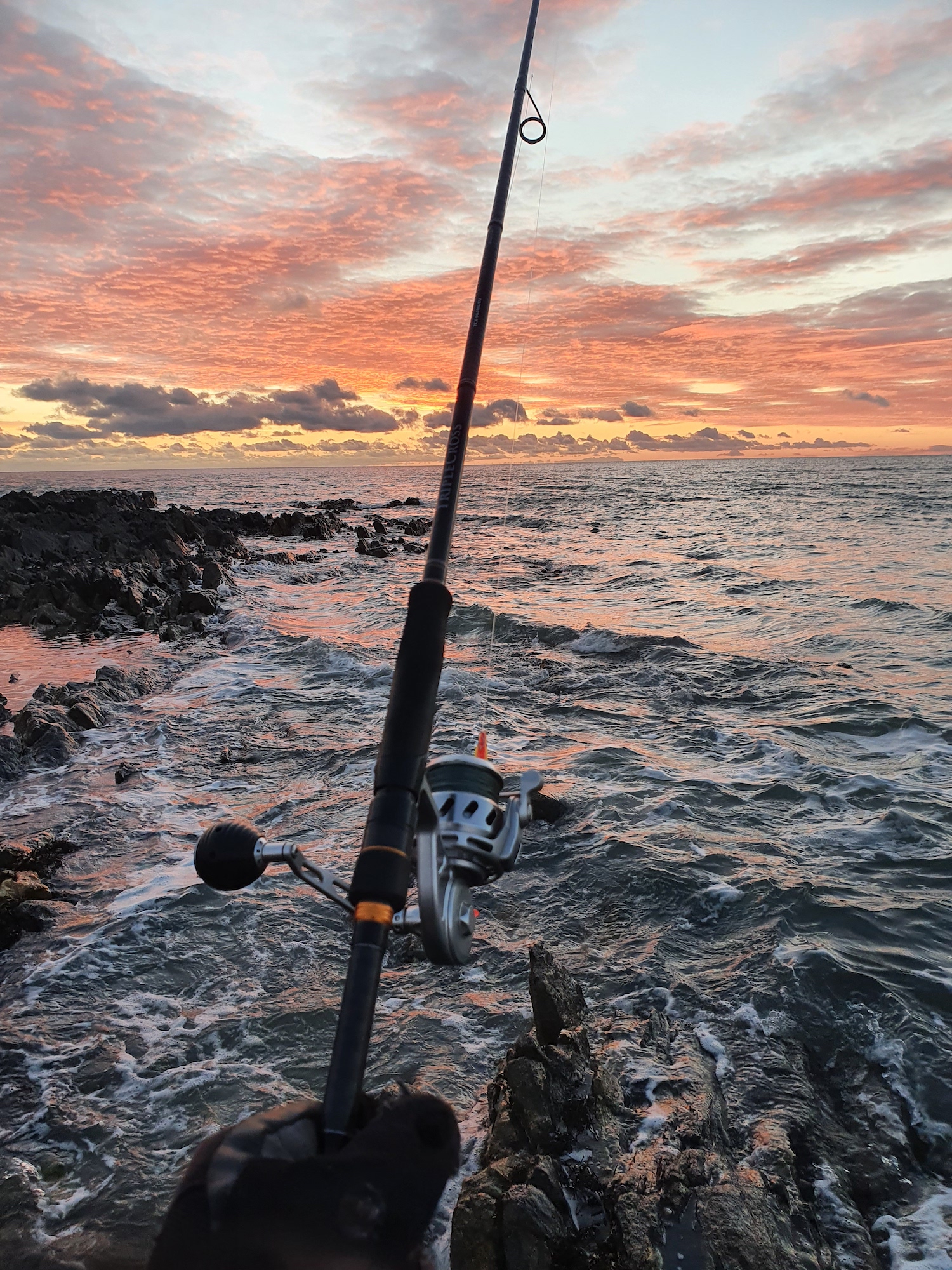 Fishing for bass at sunset