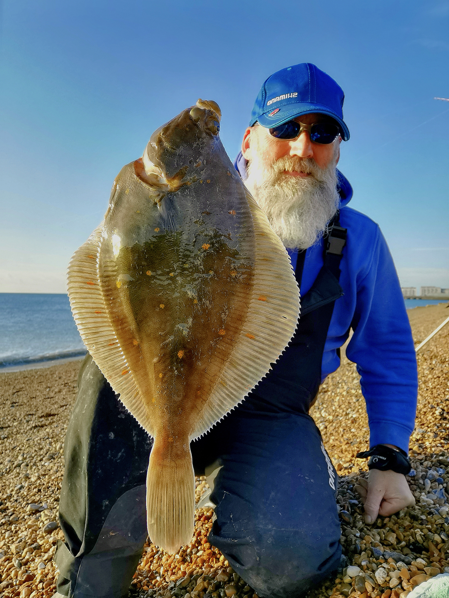 Man holding plaice catch