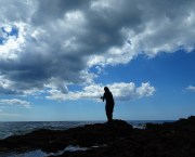 man fishing on beach