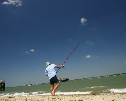 Man fishing fishing boom