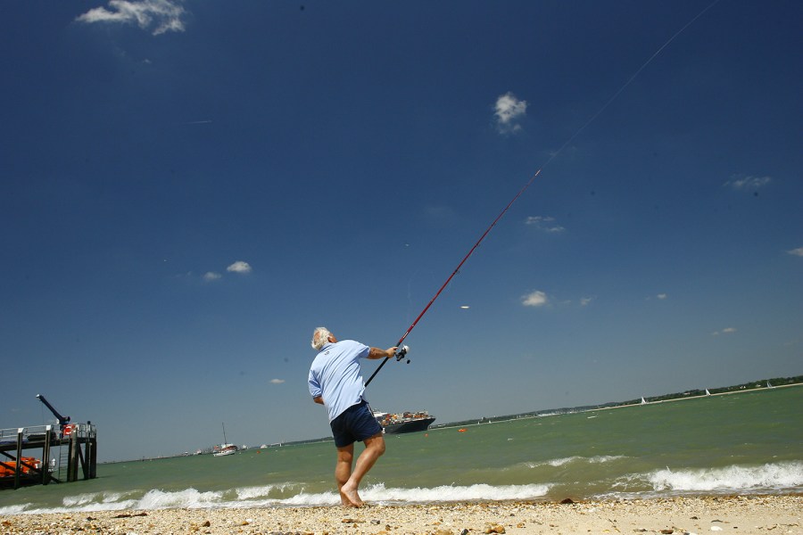 Man fishing fishing boom