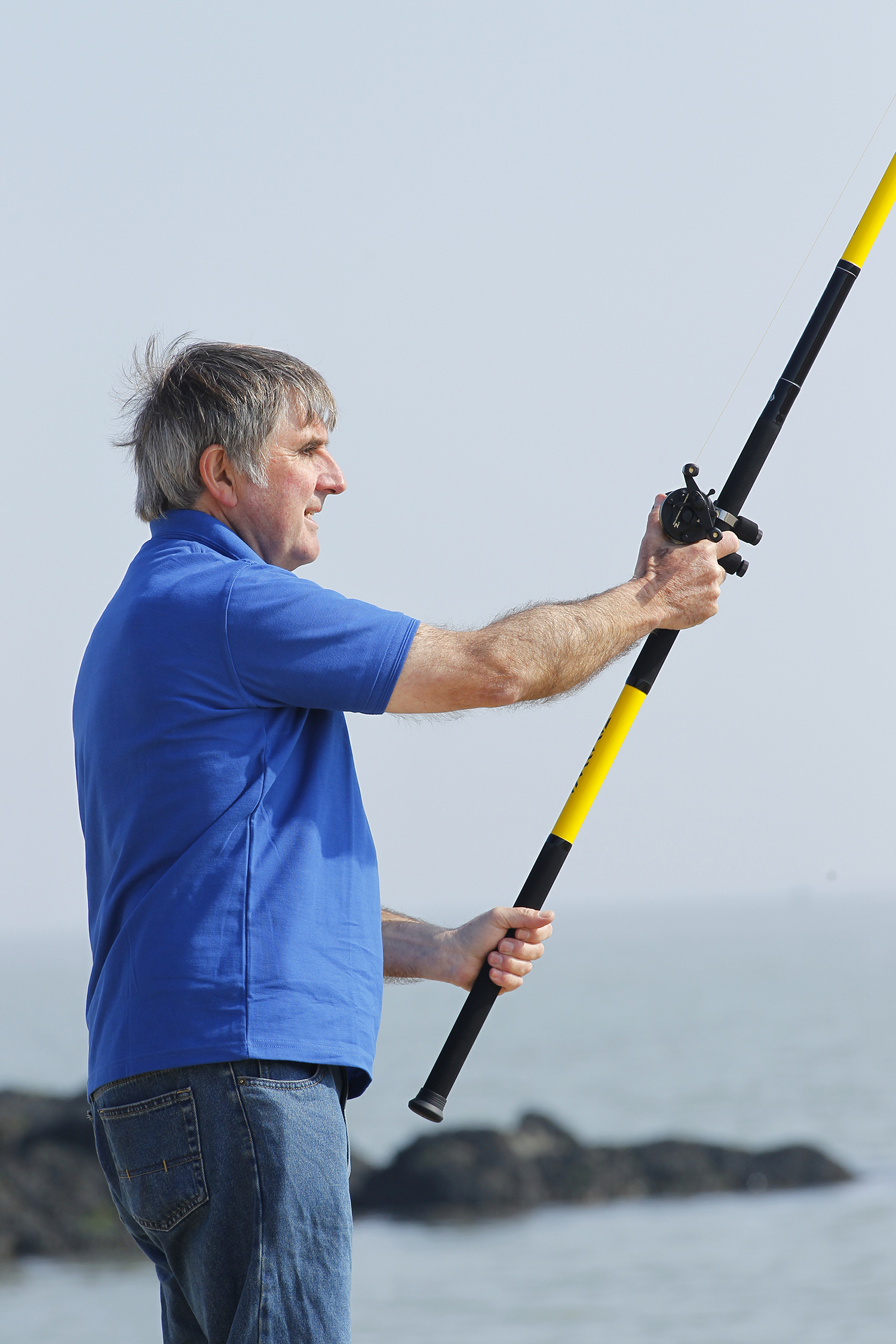 man holding fishing rod