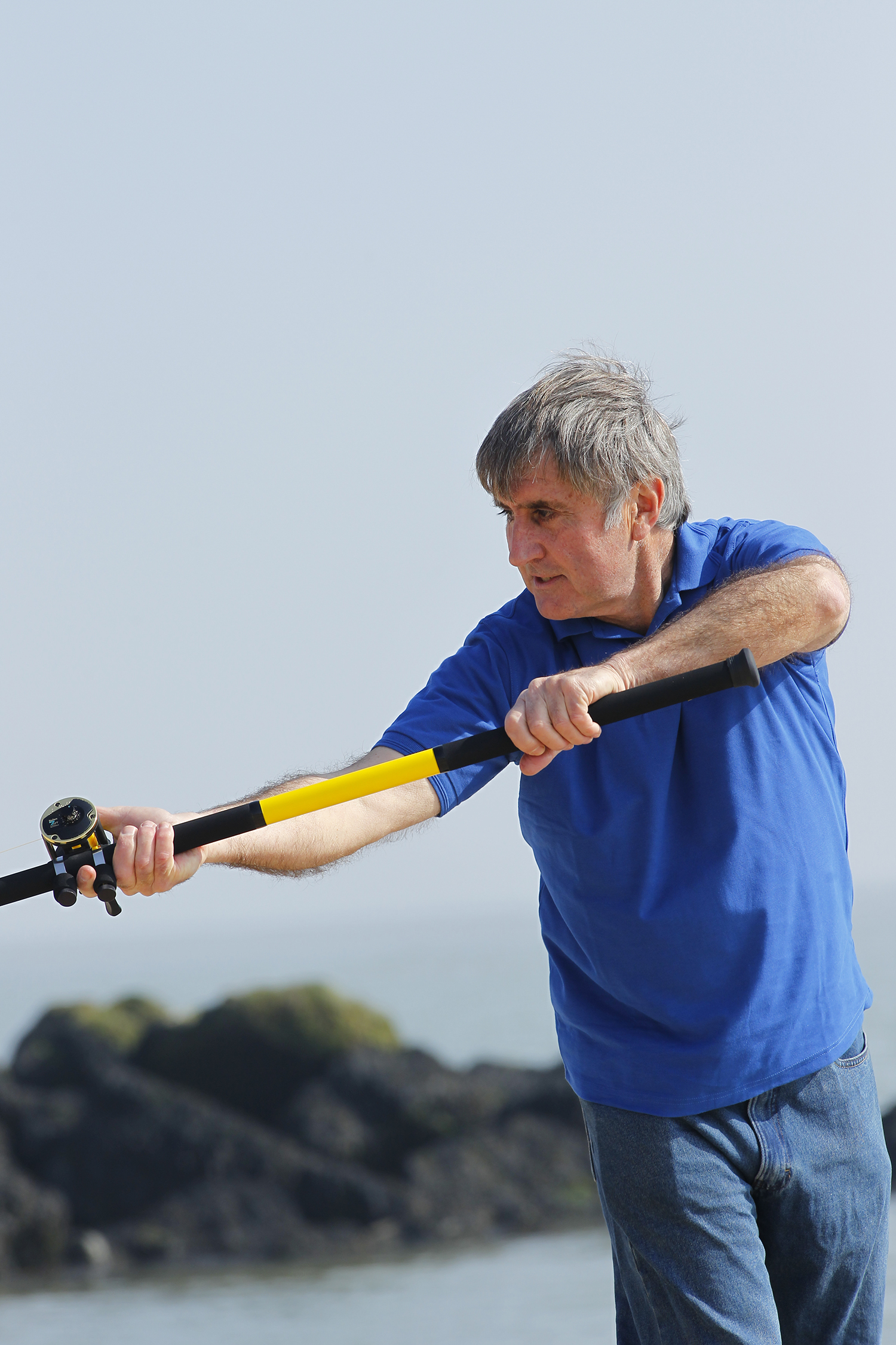 man casting his rod