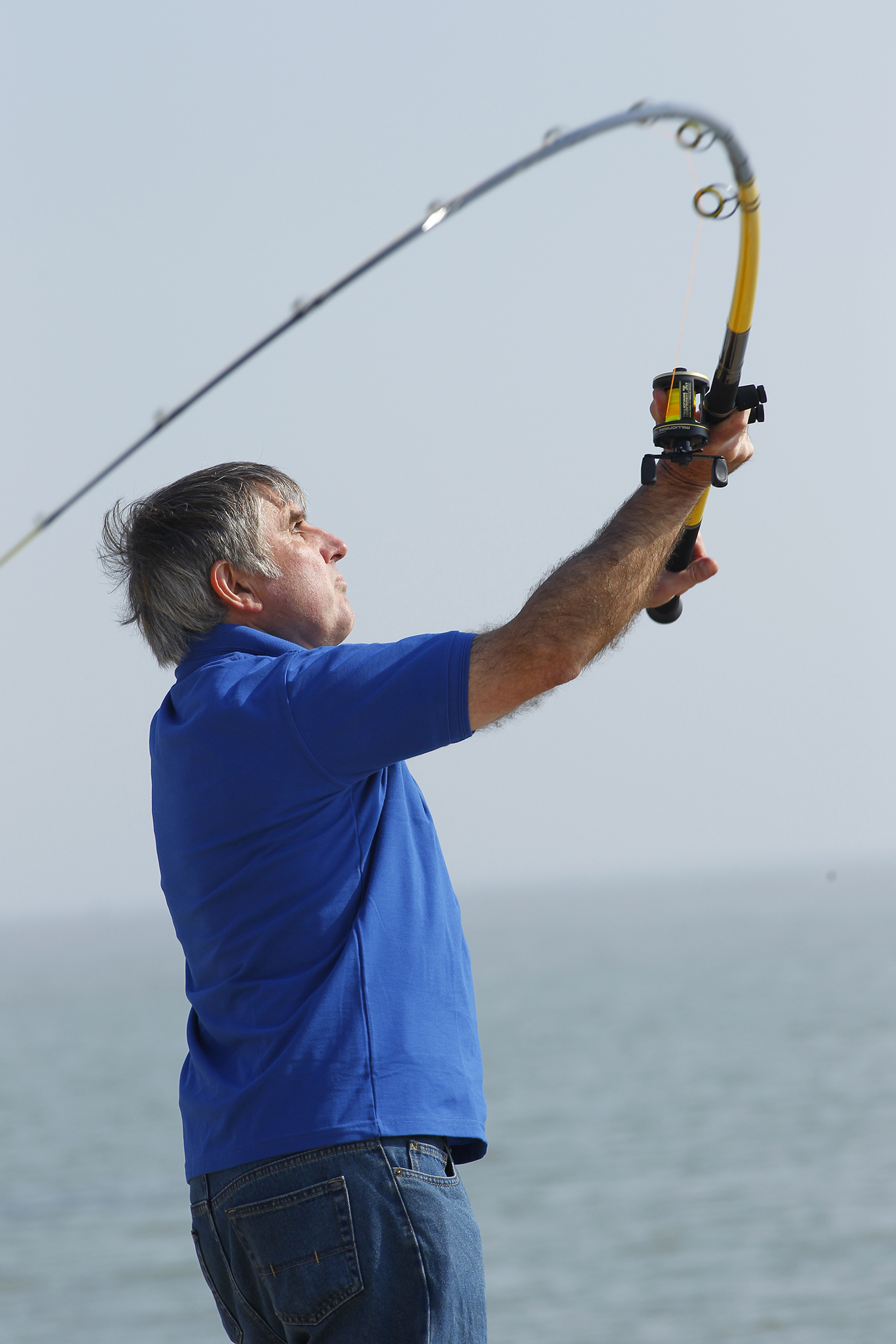 man casting his rod