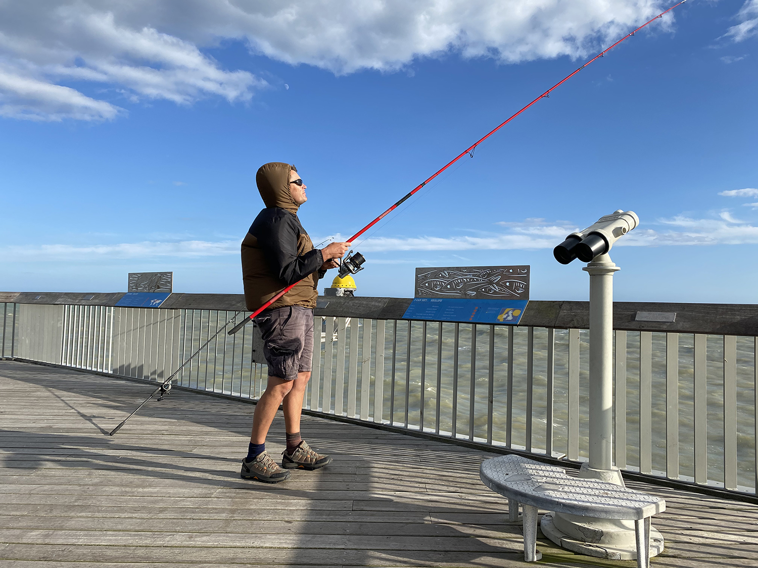 Man fishing from Hastings Pier